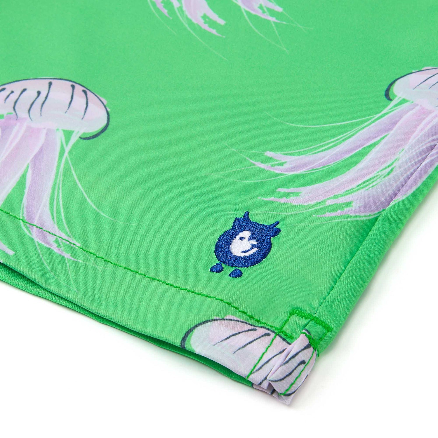 randy cow logo on swim shorts close up