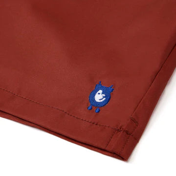 randy cow logo on red swim shorts