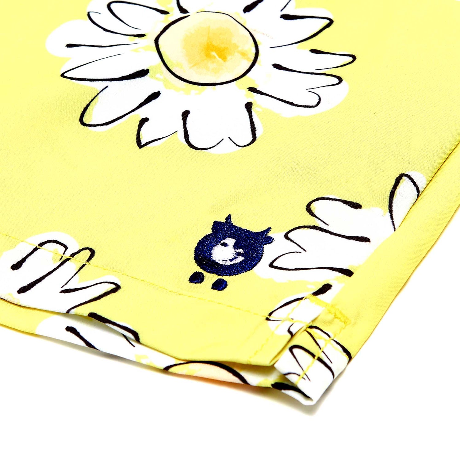 close up of randy cow logo on swim shorts