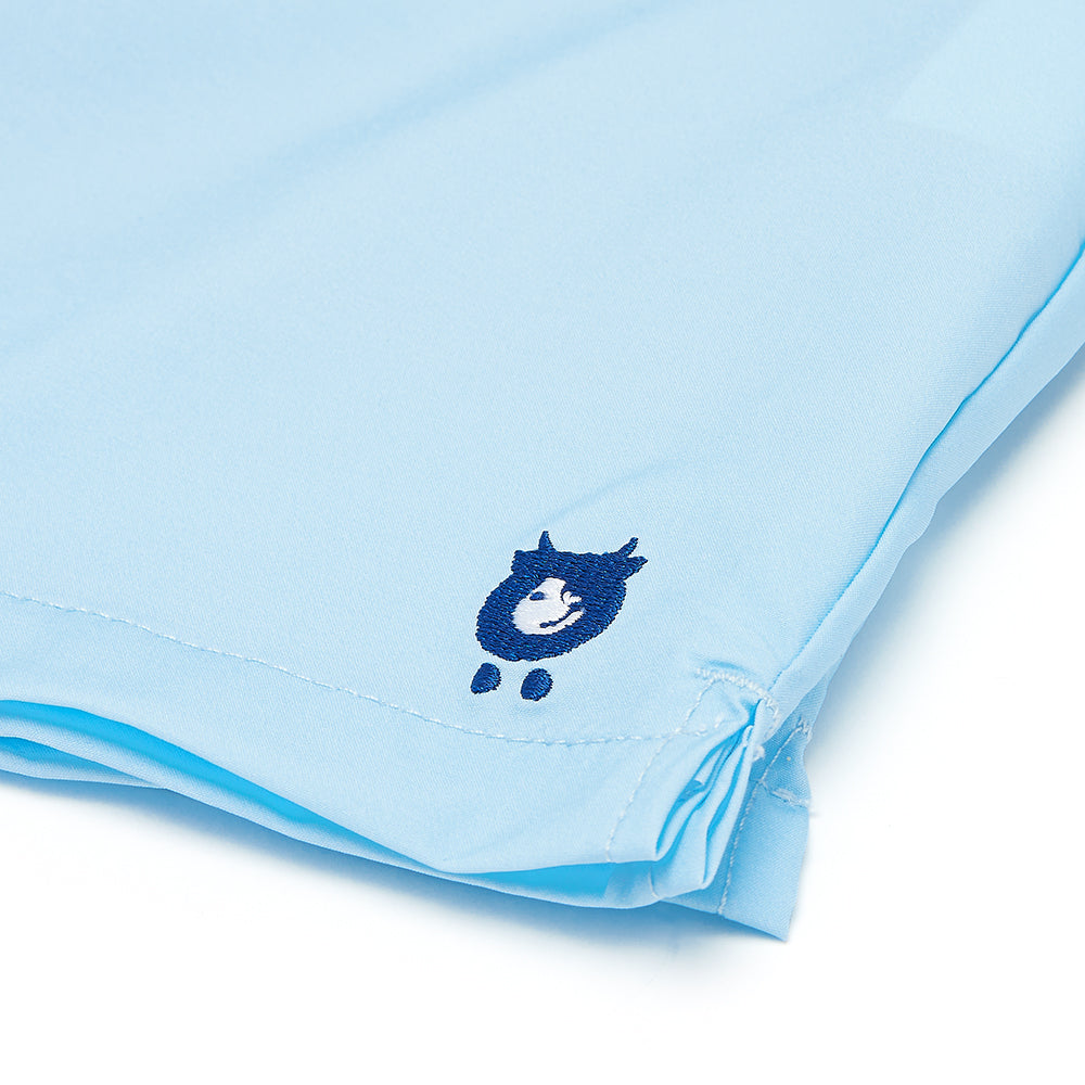 randy cow logo on light blue swim shorts