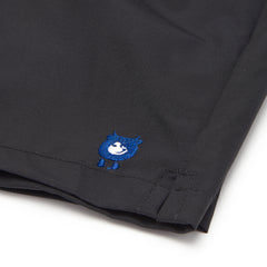 Randy Cow logo on black swim shorts