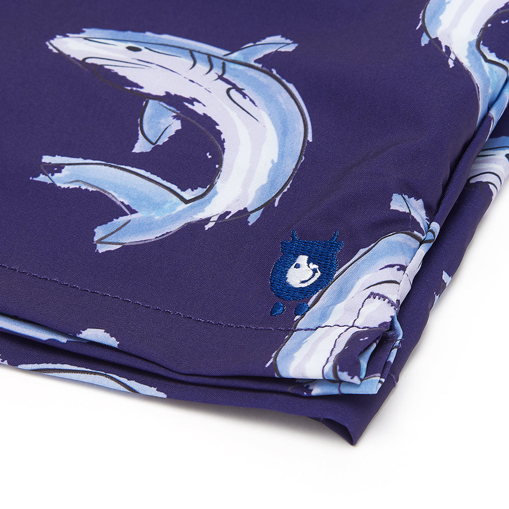 randy cow logo on swim shorts close up